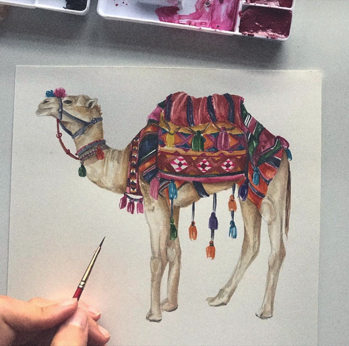 Finished camel watercolor with paintbrush